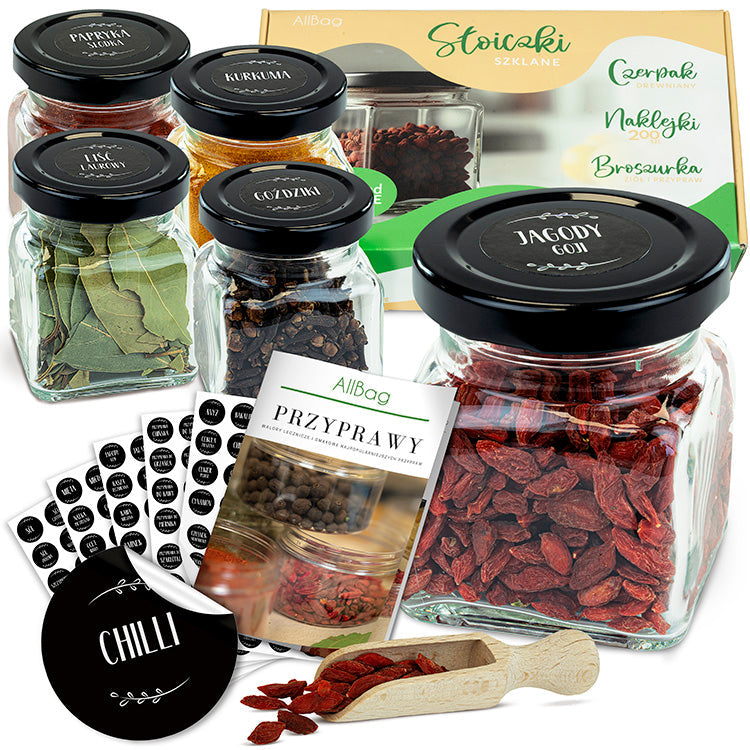 Spice jars with stickers and a scoop